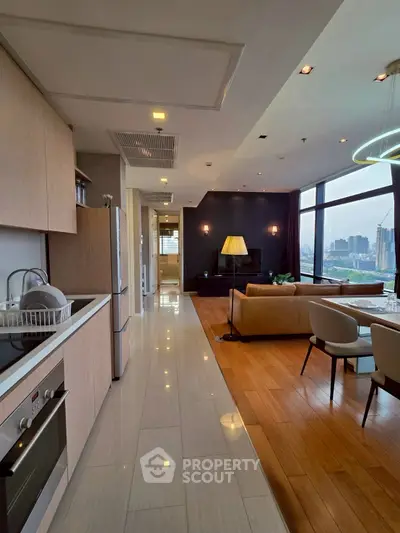 Luxurious open-plan living room with modern kitchen and stunning city view