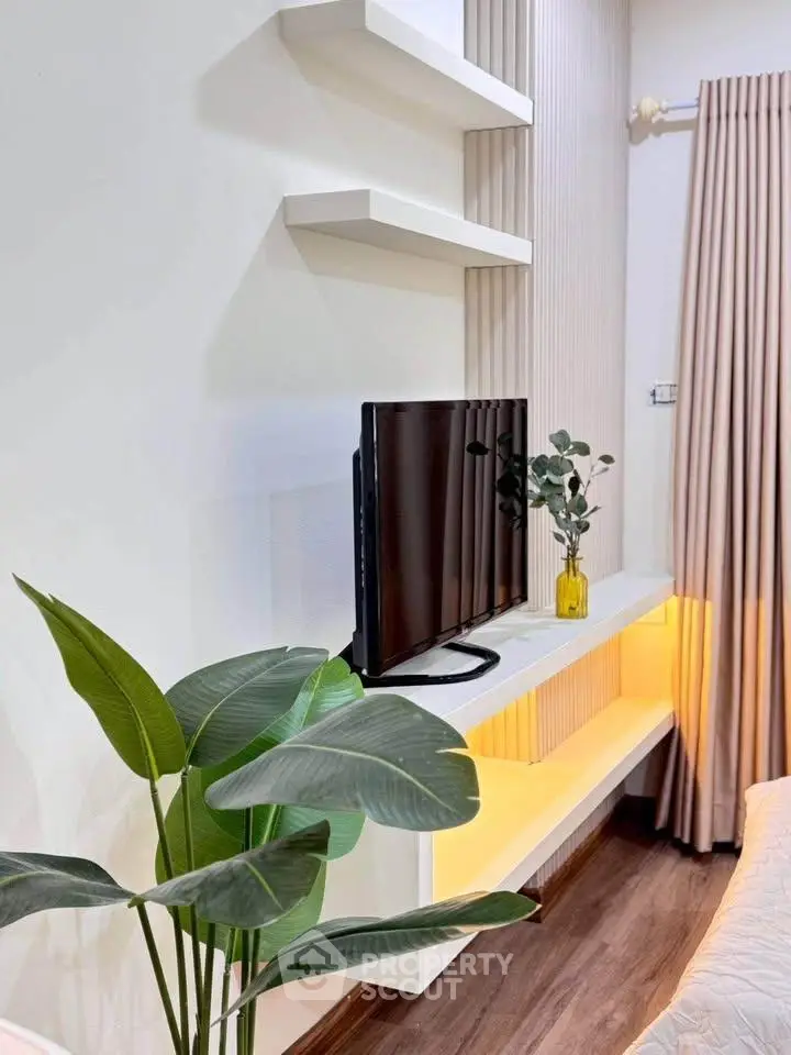 Modern living room with sleek TV setup and elegant decor