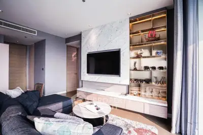 Luxurious modern living room with elegant marble TV wall and stylish shelving