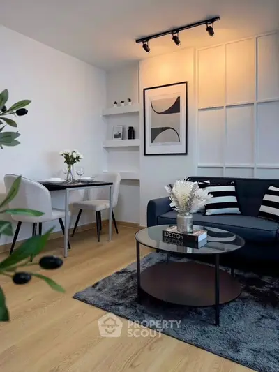 Modern living room with stylish decor, cozy seating, and elegant dining area, perfect for urban living.