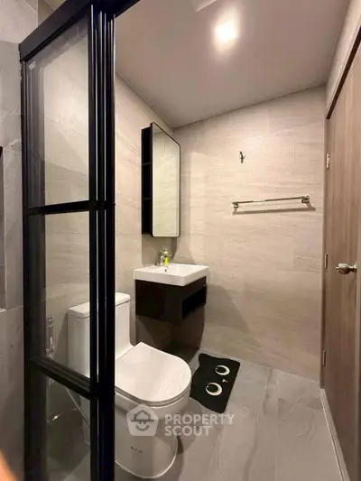 Modern bathroom with sleek design and glass shower partition