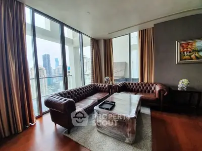 Luxurious living room with stunning city view and elegant leather sofas
