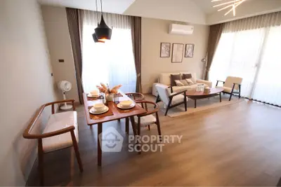 Modern living room with elegant dining area and stylish decor