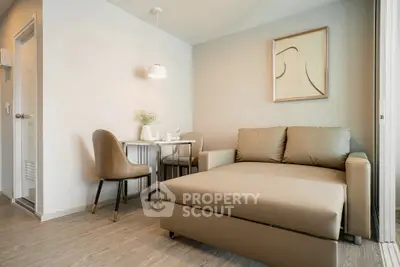 Modern living room with stylish furniture and elegant decor in a cozy apartment setting.