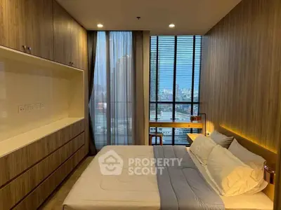 Luxurious bedroom with city view, featuring modern wood paneling and ambient lighting.