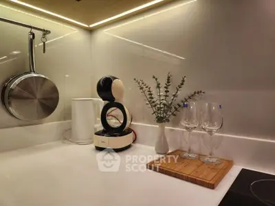 Modern kitchen corner with sleek appliances and elegant decor