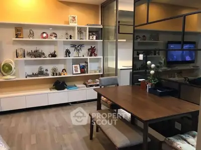 Stylish modern living room with sleek shelving and elegant dining area, perfect for urban living.