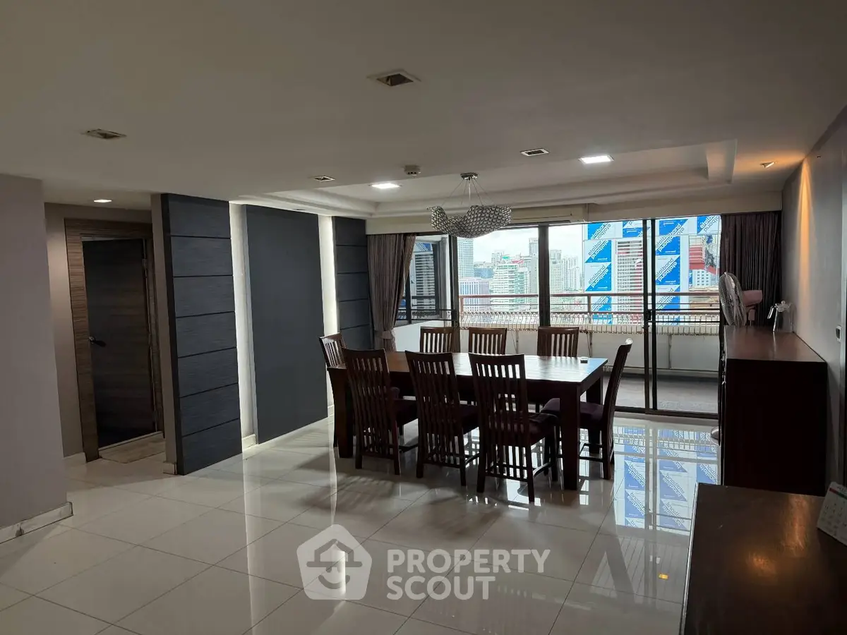 Spacious dining area with city view and elegant wooden furniture