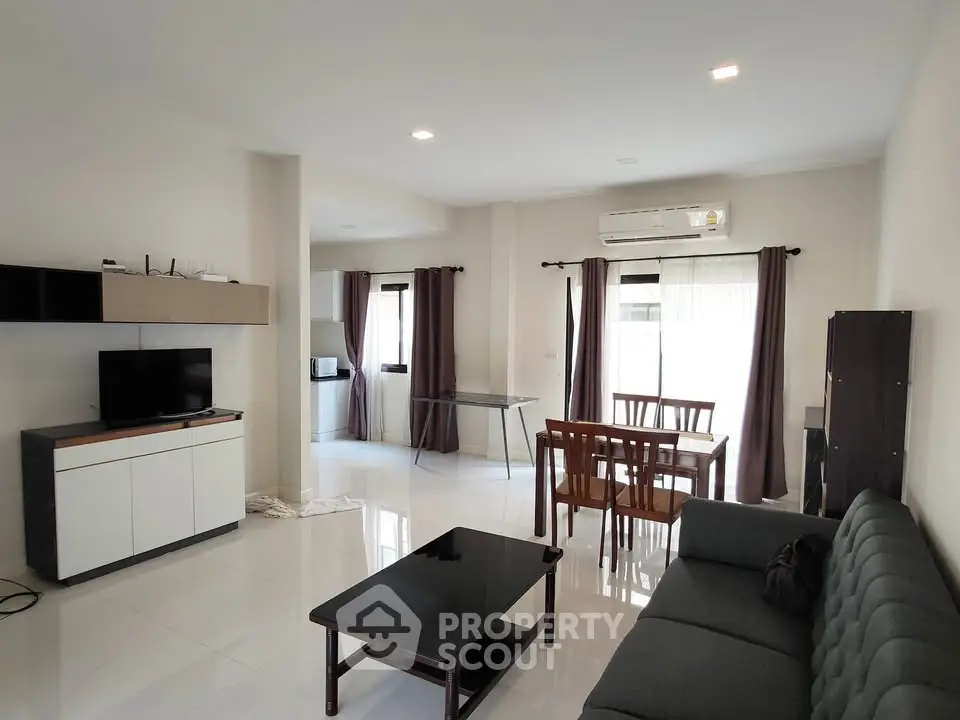 Spacious modern living room with sleek furniture and natural light