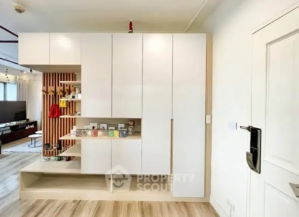 Modern living room with sleek storage cabinets and stylish decor