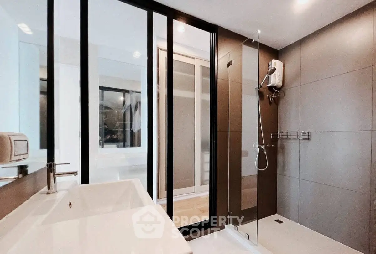 Modern bathroom with sleek design and glass shower enclosure