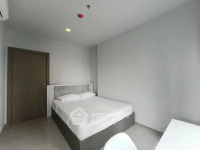 Modern minimalist bedroom with sleek design and neutral tones, perfect for a serene living experience.