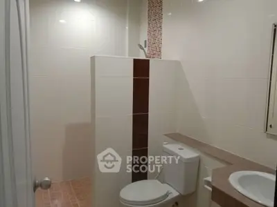 Modern bathroom with sleek design and tiled shower area