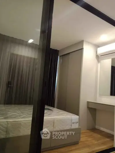 Modern bedroom with glass partition and sleek design