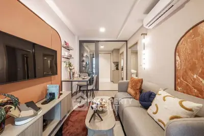 Modern living room with stylish decor and cozy seating area, perfect for relaxation and entertainment.
