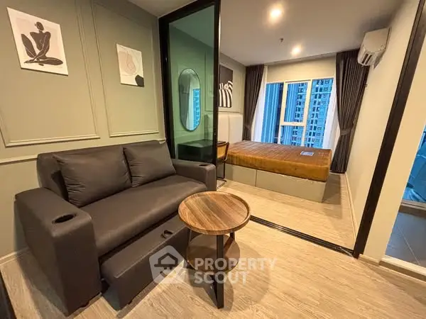 Modern studio apartment with cozy living area and stylish decor