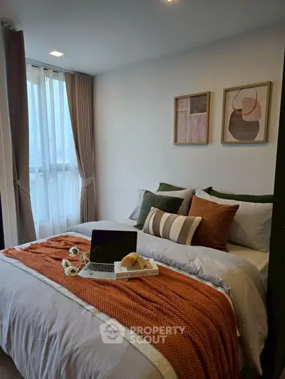 Cozy bedroom with stylish decor and natural light