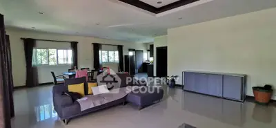 Spacious living room with modern furniture and natural light