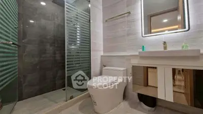 Modern bathroom with sleek design and glass shower enclosure