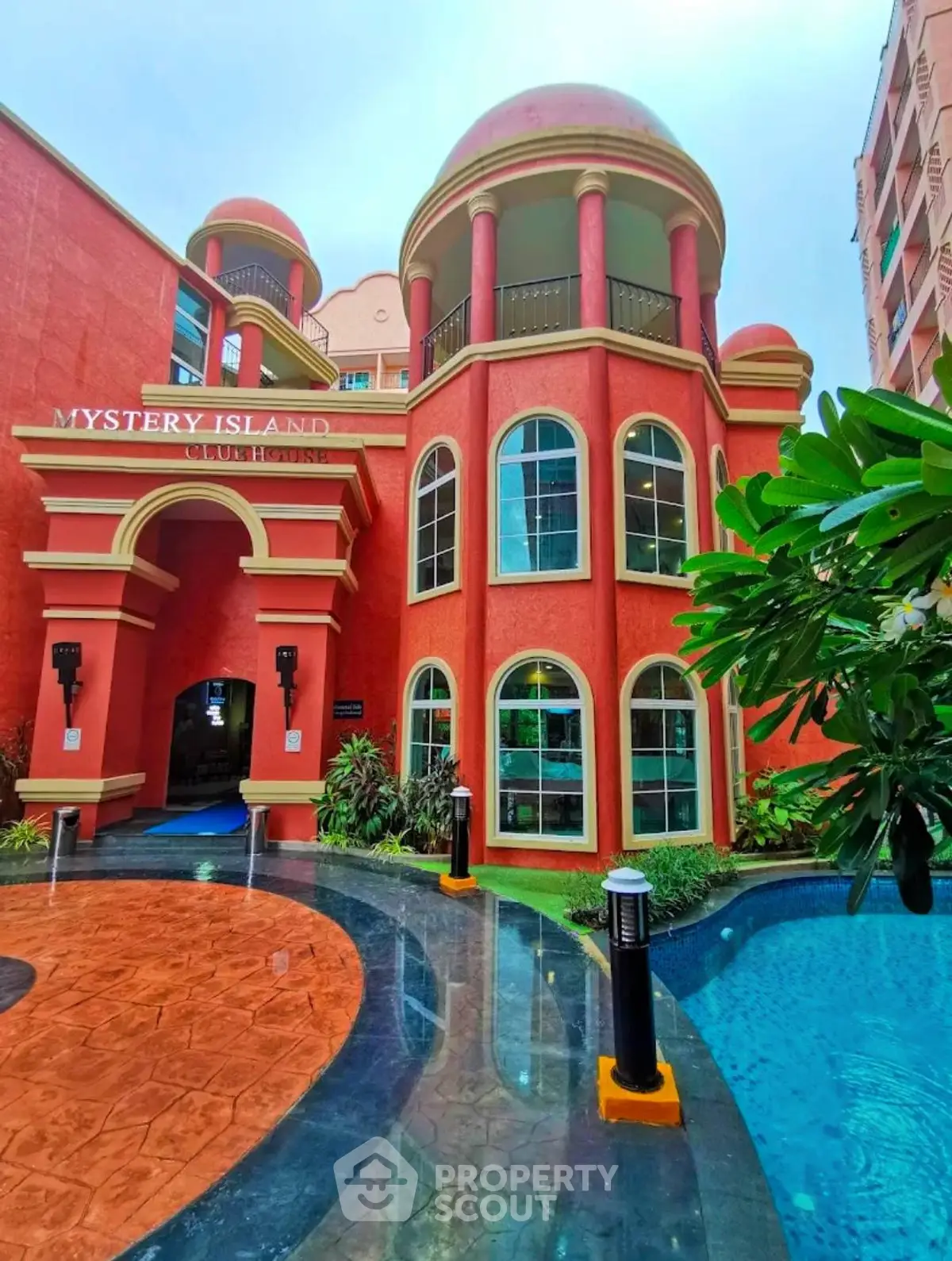 Stunning architectural entrance of Mystery Island building with vibrant colors and unique design.