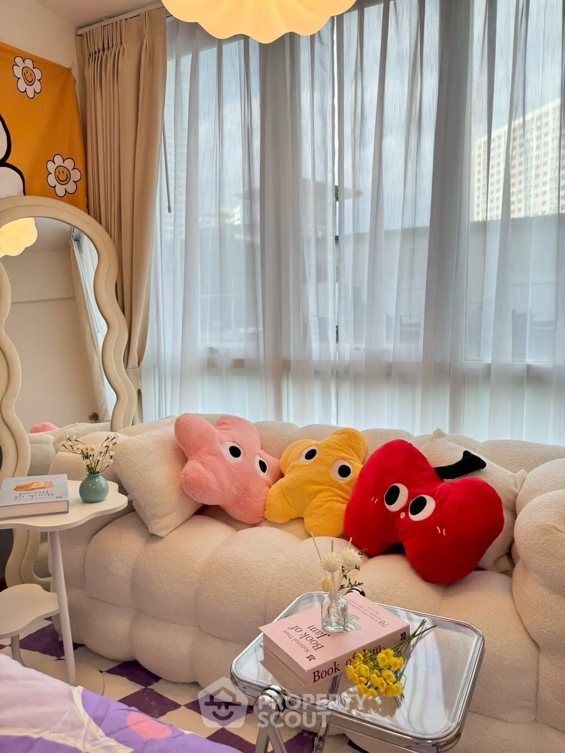 Charming living room with plush sofa and playful decor, perfect for cozy relaxation.