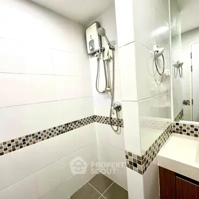 Modern bathroom with sleek tiles and built-in shower unit