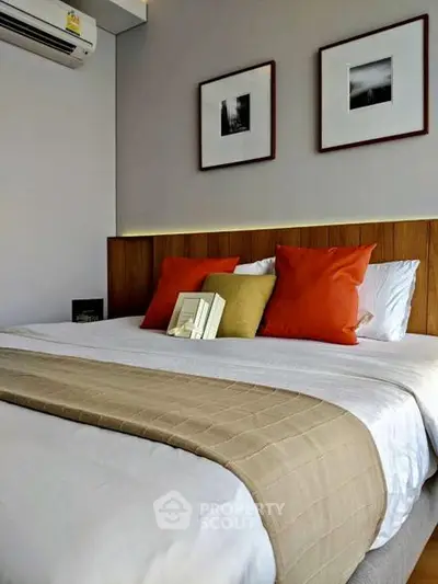Cozy bedroom with stylish decor and modern air conditioning unit