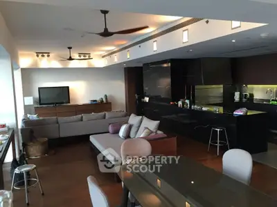 Spacious modern living room with open kitchen and stylish decor