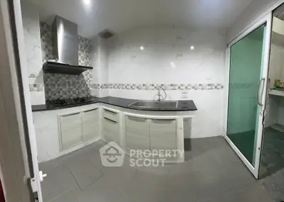 Modern kitchen with sleek design and gas stove in a contemporary home