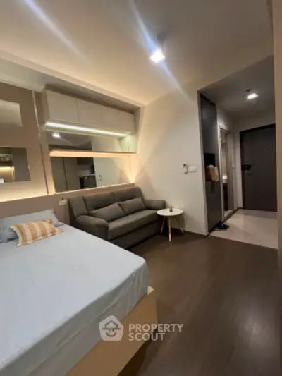 Modern studio apartment with cozy living area and stylish decor