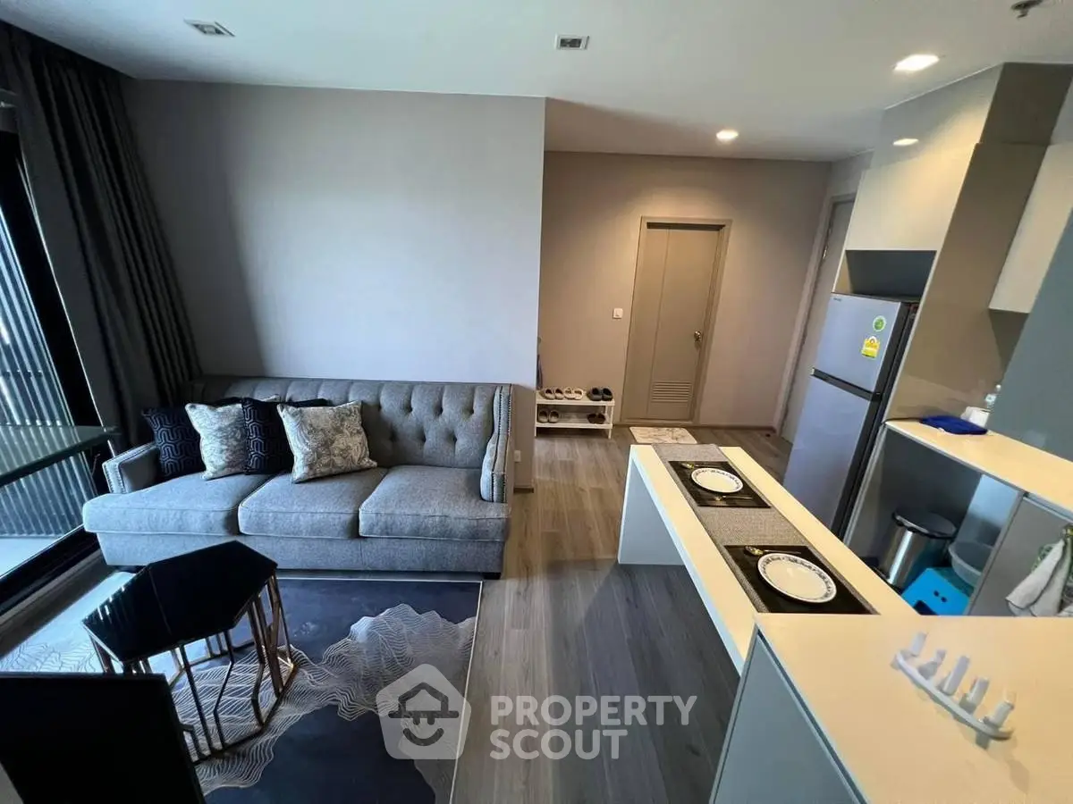 Modern living room with open kitchen and stylish decor