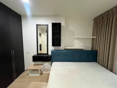 Modern bedroom with stylish furniture and ample storage space, featuring a comfortable bed and sleek design.