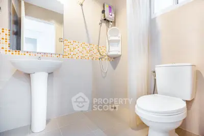 Modern bathroom with sleek fixtures and stylish tile accents, perfect for contemporary living.