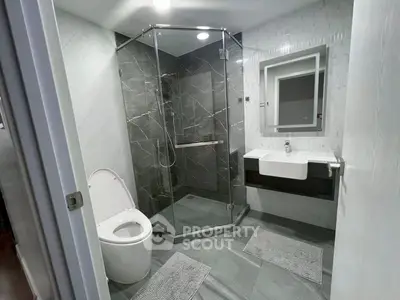 Modern bathroom with glass shower and sleek design