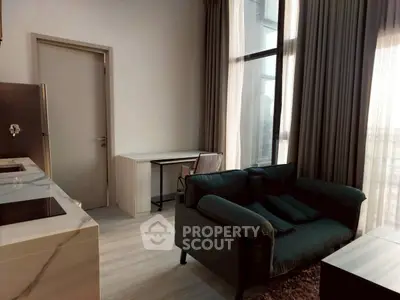 Modern living room with large windows and stylish furniture in a high-rise apartment.