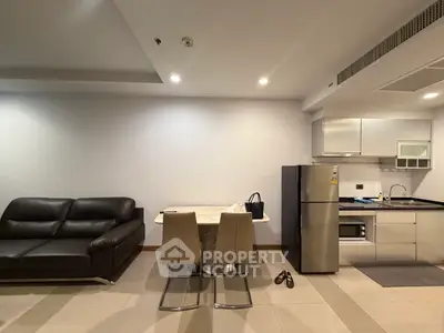 Modern apartment interior with sleek kitchen and cozy living area