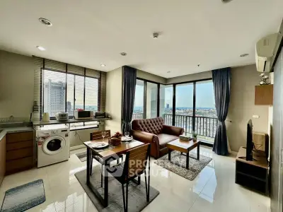 Modern living room with city view, featuring open kitchen and stylish decor.