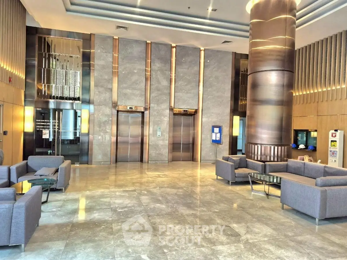 Luxurious building lobby with modern elevators and elegant seating area