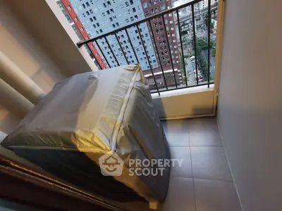 Compact balcony with covered washing machine and city view