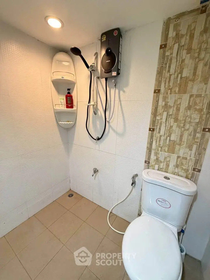 Modern bathroom with shower and toilet in a minimalist design