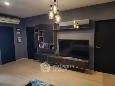 Modern living room with stylish TV unit and elegant lighting fixtures