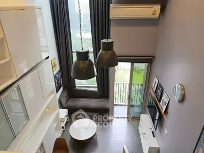 Modern loft apartment with high ceilings and balcony view