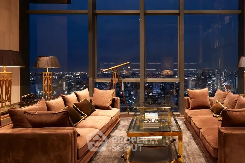 Luxurious living room with stunning city view, elegant decor, and telescope for star gazing.