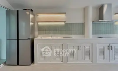 Modern kitchen with sleek appliances and stylish cabinetry