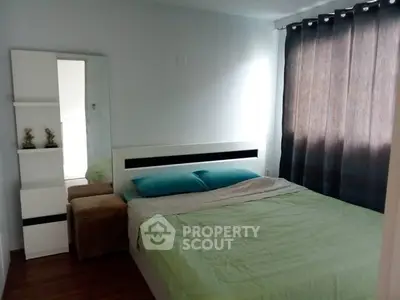 Cozy bedroom with modern decor and ample natural light