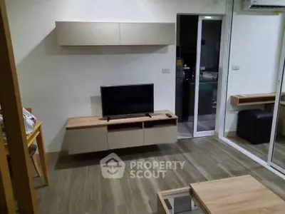 Modern living room with sleek TV unit and stylish wooden flooring