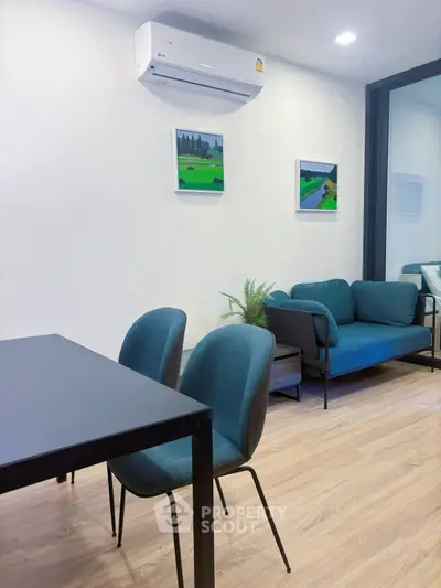 Modern living room with sleek furniture and air conditioning, perfect for urban living.