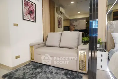 Modern living room with stylish sofa and elegant decor in a cozy apartment setting.