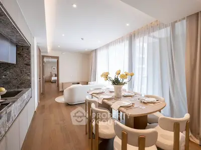 Elegant dining area with modern decor and natural light in a luxurious apartment.