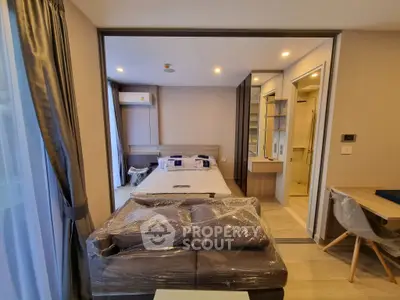 Modern studio apartment with cozy bedroom and stylish furniture